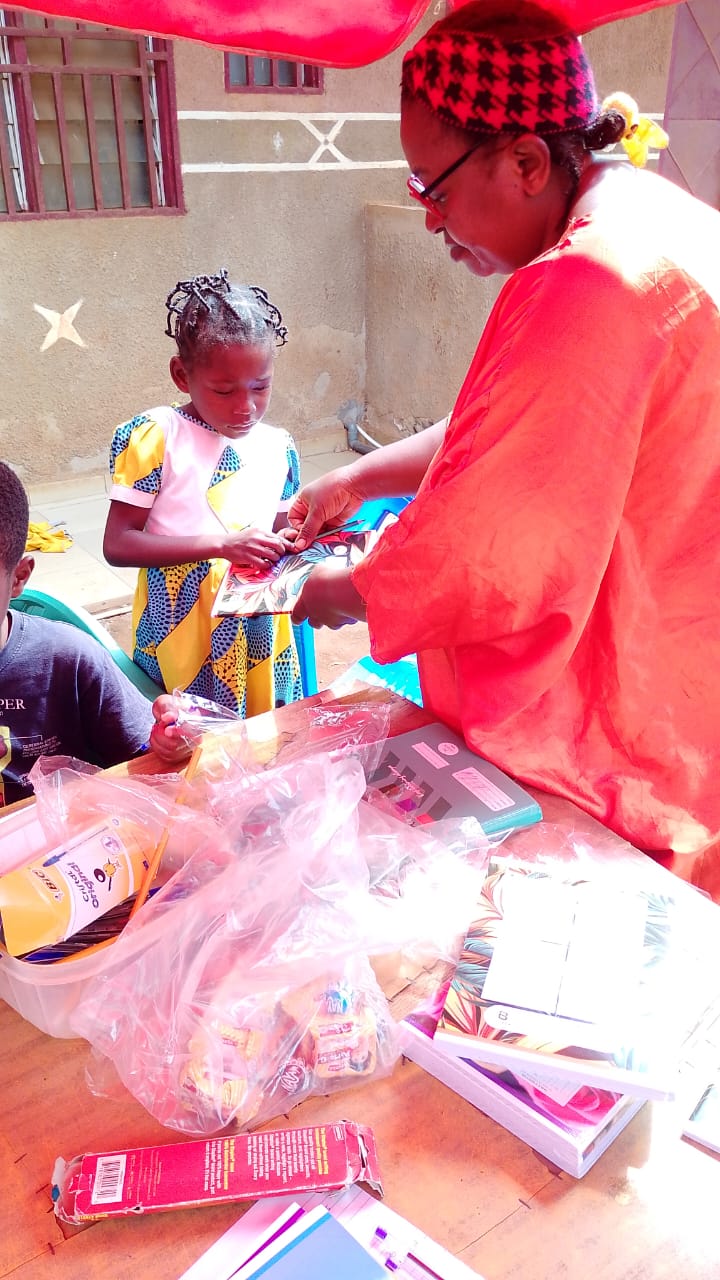 Girl receiving school supplies