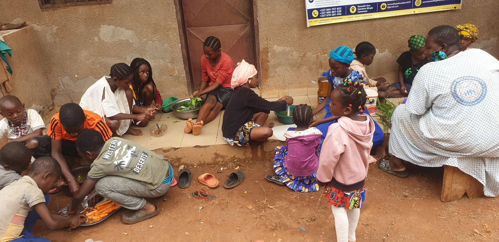 Children and staff preparing a meal together during the Holiday Workshop
